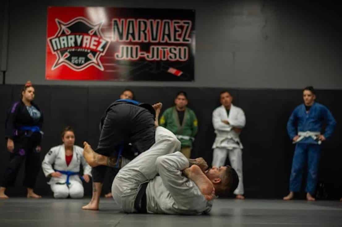 Coach Roger showing a technique in the gi.